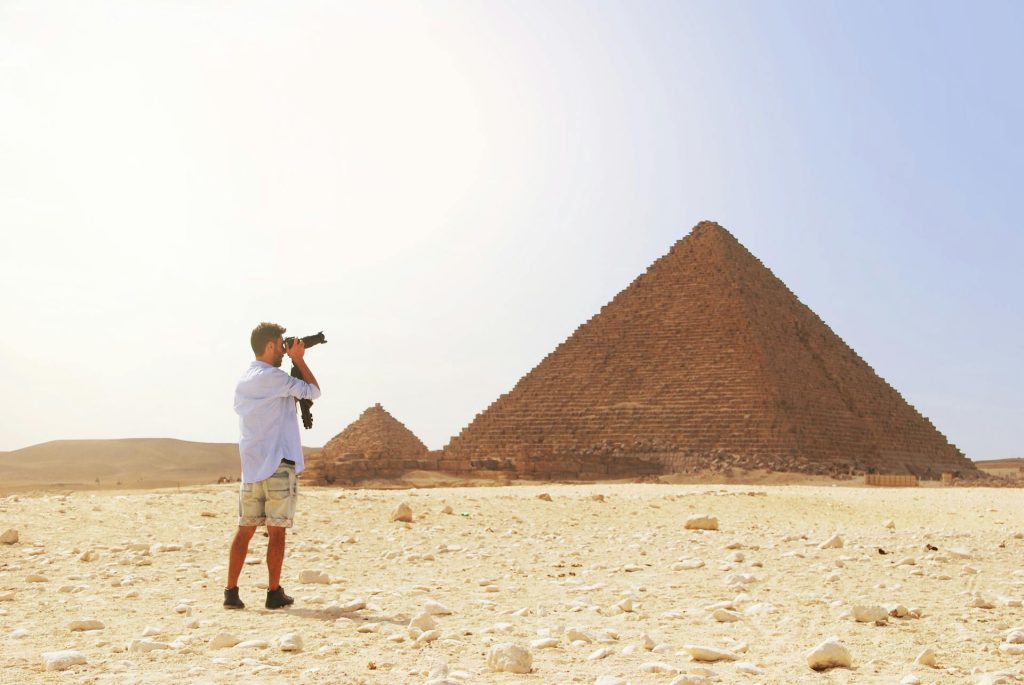 Man on a trip to the pyramids in Egypt